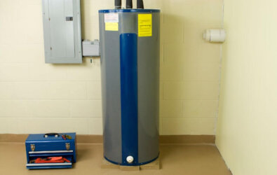Residential water heater with a toolbox next to it