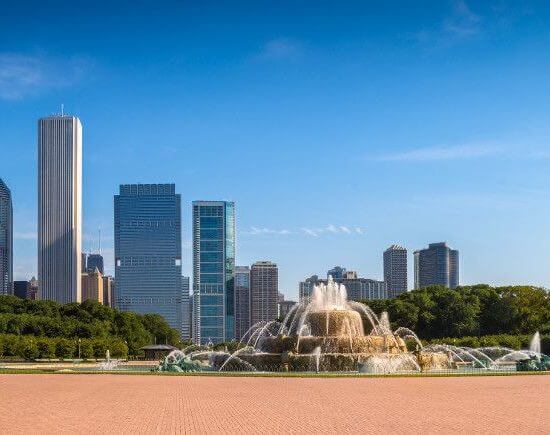 Photo of Chicago in the background with the Buckingham Fountain in Grant Park.