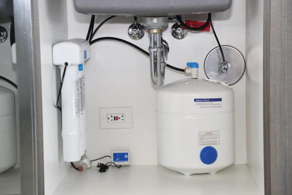 An image of an under-the-sink reverse osmosis system. 