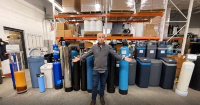 Drew the Water Guru standing in front of the best water softeners for 2024