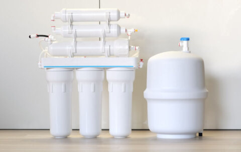 A reverse osmosis system sits on a counter
