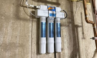 A reverse osmosis system in a basement for a blog on how does a reverse osmosis system work